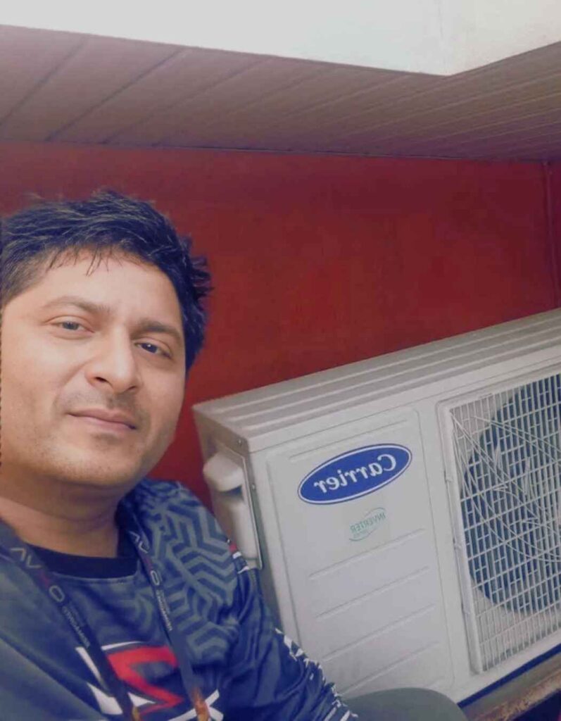 Debojyoti Barman testing a Carrier Inverter AC Outdoor Unit