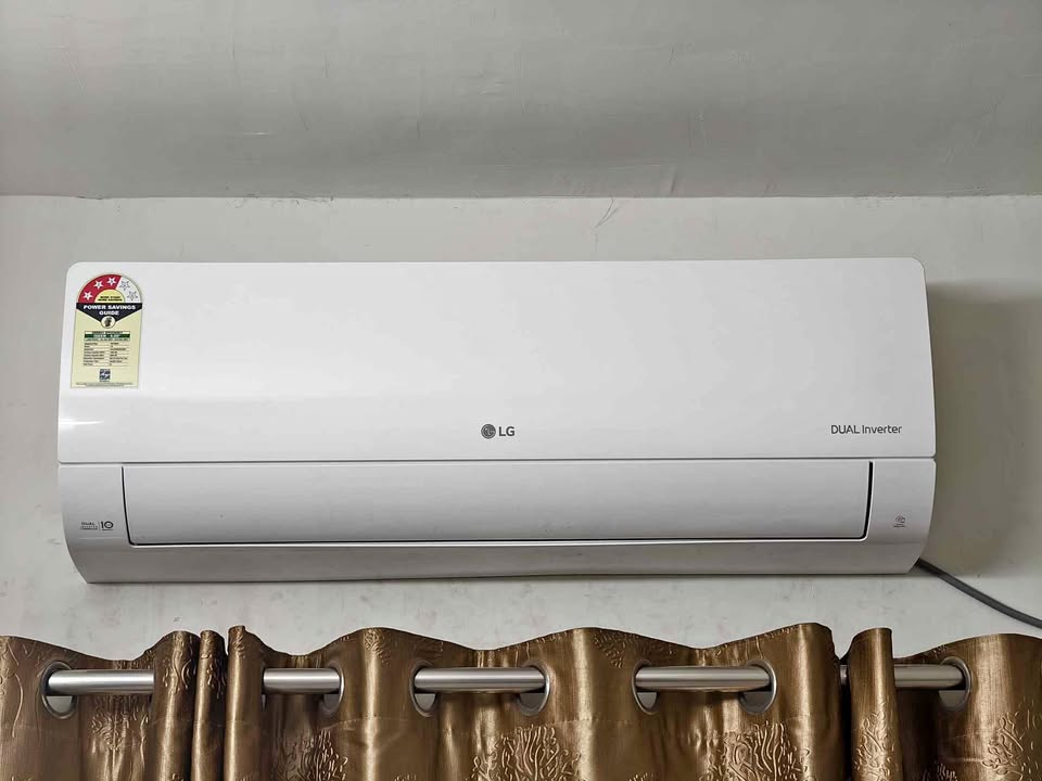 Close-up of LG 2 Ton 3 Star Dual Inverter split AC indoor unit (Model US Q24ENXE) wall-mounted